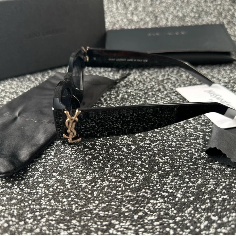 Yves Saint Laurent Black Sunglasses with Gold Logo
Never used
